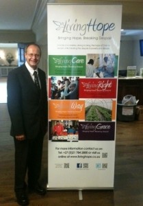 John Thomas with Living Hope Ministries Banner