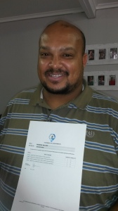 Nathan Panti displays the Statement of Achievements certificate with Services SETA approved results